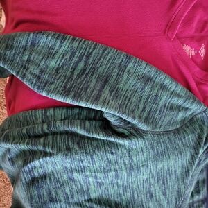 Two St. John's Bay (J.C. Penny brand) fleece, V-Neck pullovers in size medium.